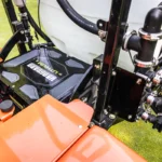 Close-up of Smithco Spray Star 1200 E's precision spraying system, featuring advanced controls and nozzle assembly, highlighting eco-friendly turf maintenance technology.